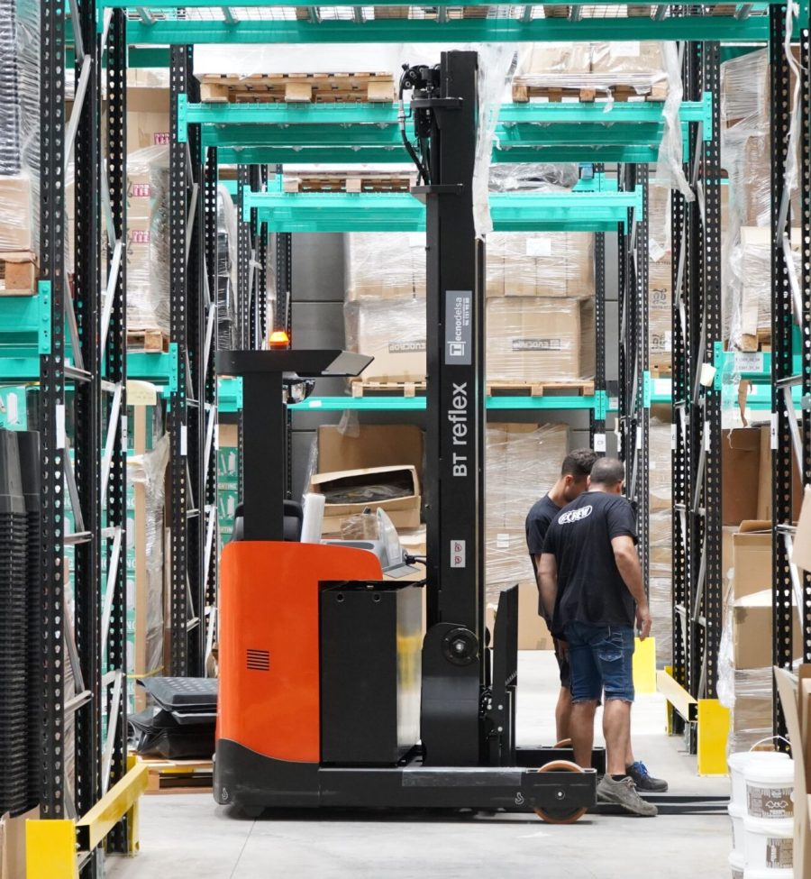 Forklift operator in distribution warehouse